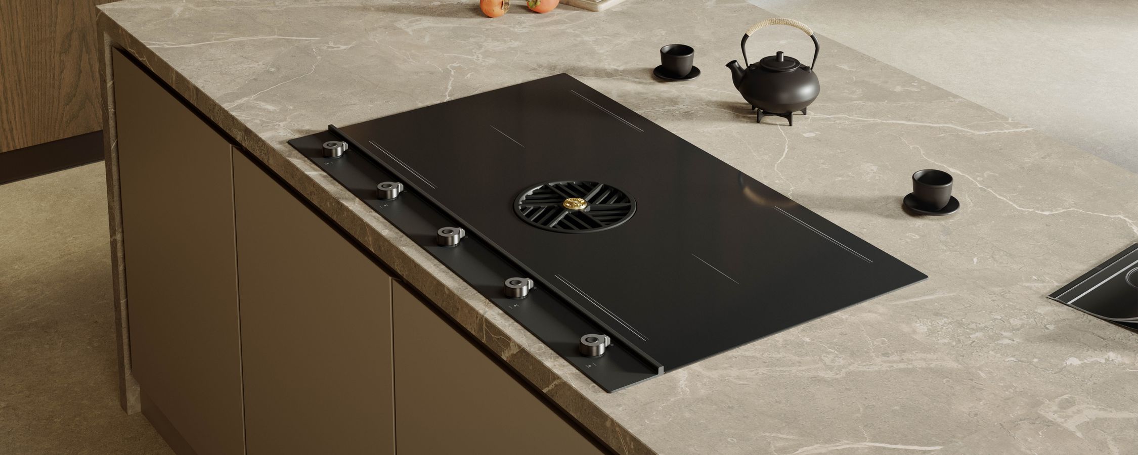 Table induction Bertazzoni à hotte intégrée et manettes, nouveauté 2026, sur un plan en pierre
