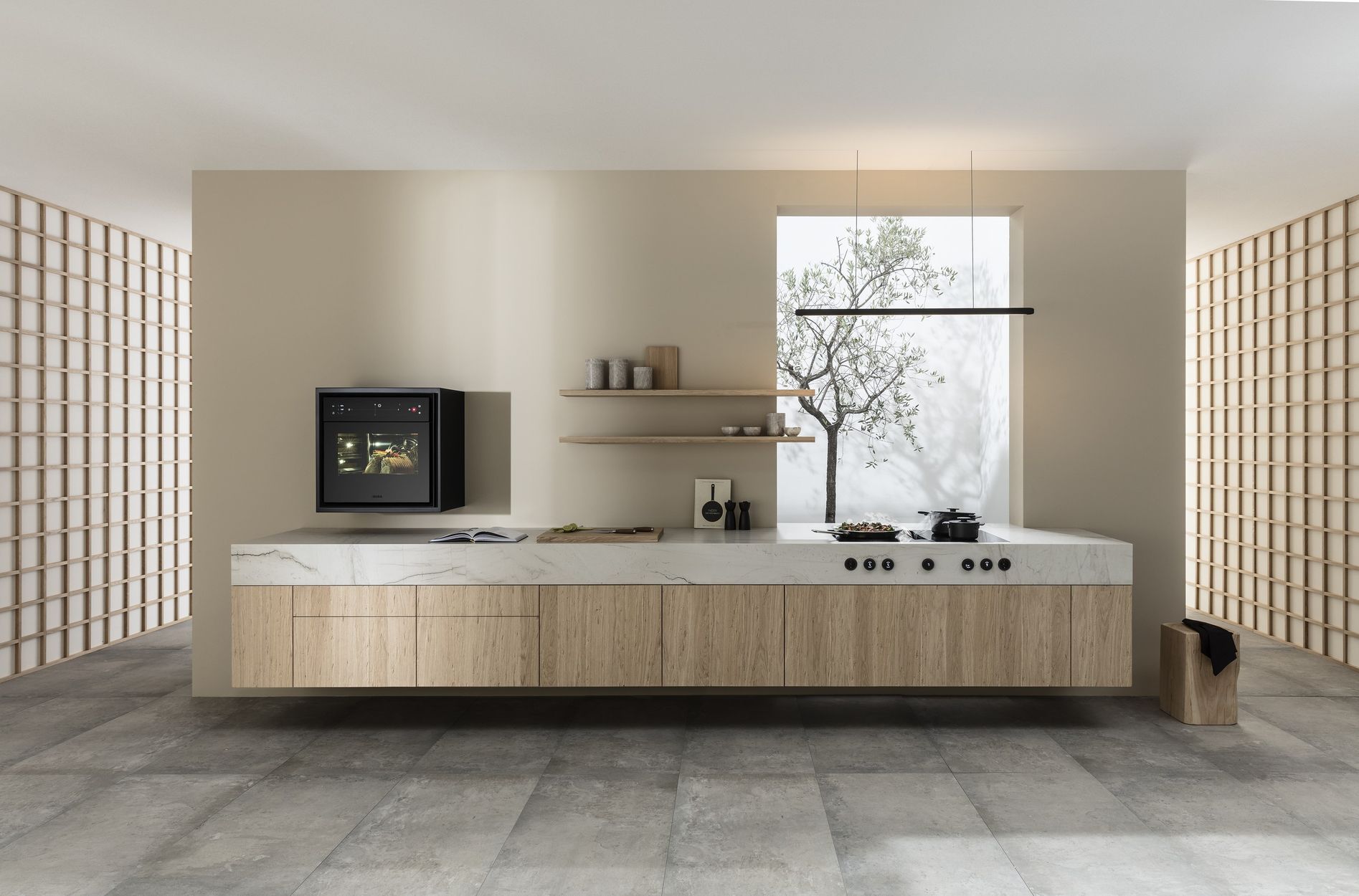Cuisine linéaire en bois clair et plan en pierre, table BORA et four vapeur X BO encastré au mur