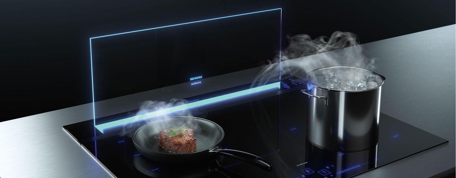 Hotte de plan de travail Siemens glassdraftAir, paroi de verre éclairée derrière la table